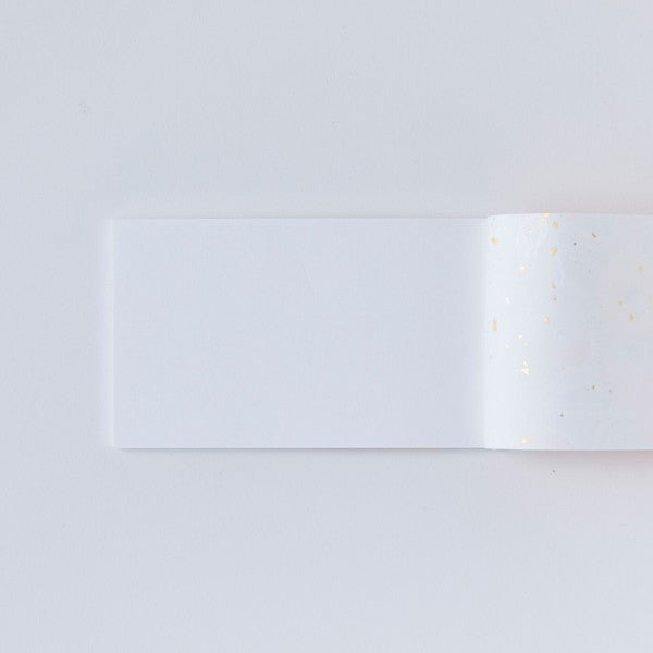 Small Japanese hand-bound memo pad with a pink floral design on Yuzen washi paper